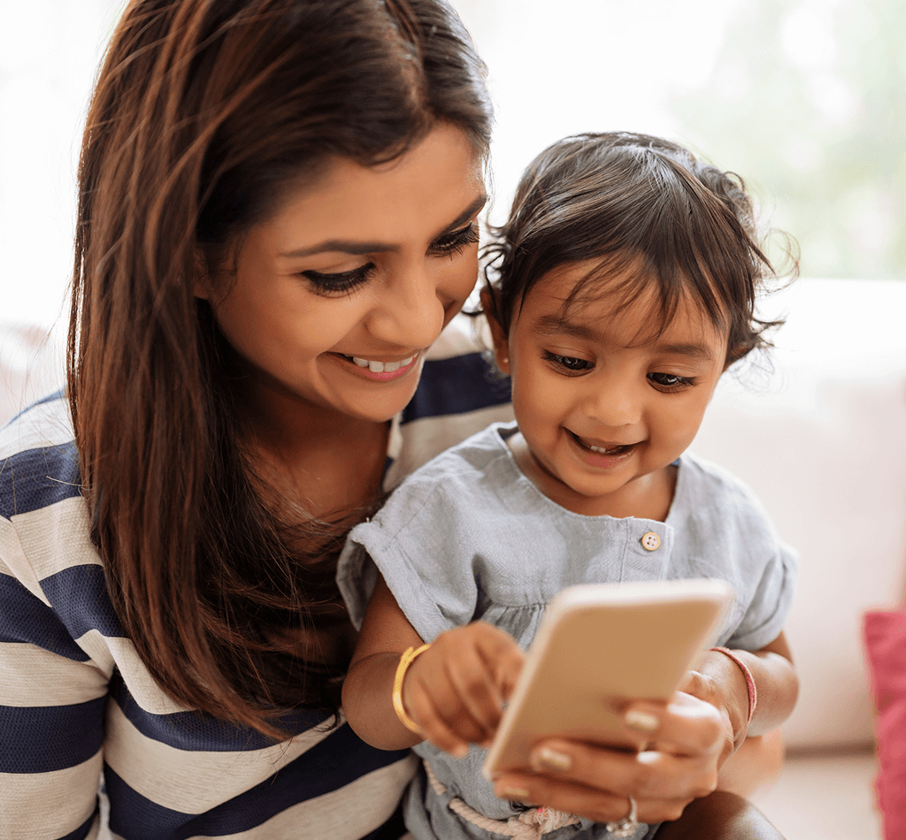 Mum and bub playing with a phone