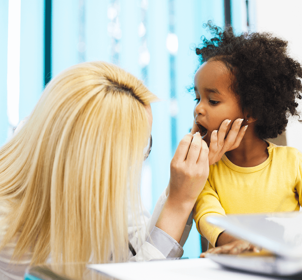 Doctor getting a sample from a young girl